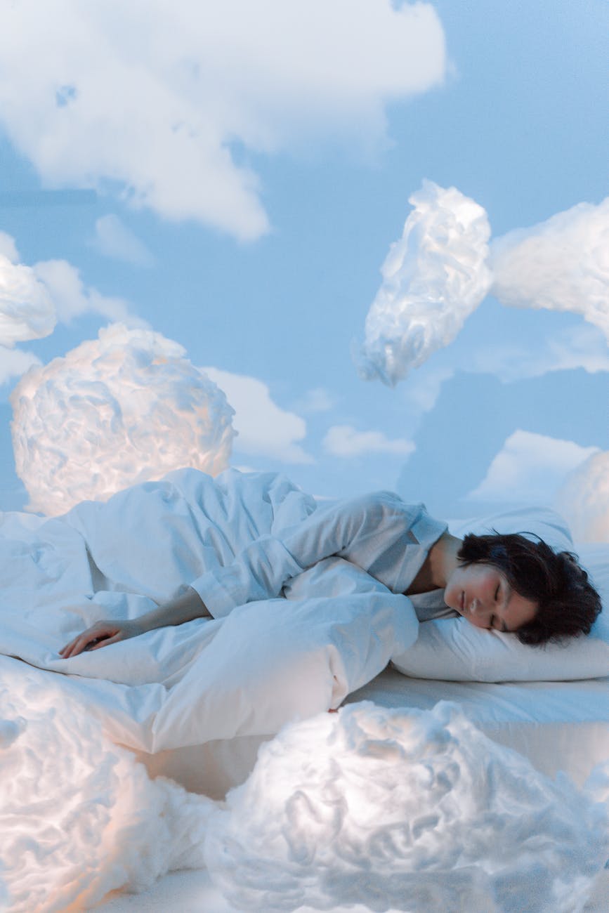photo of a woman dreaming of the clouds in her sleep