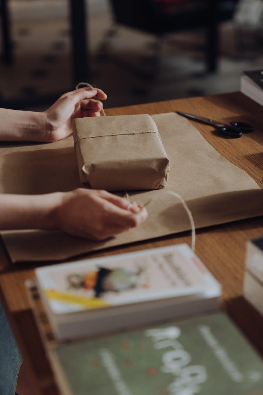 person holding brown paper bag