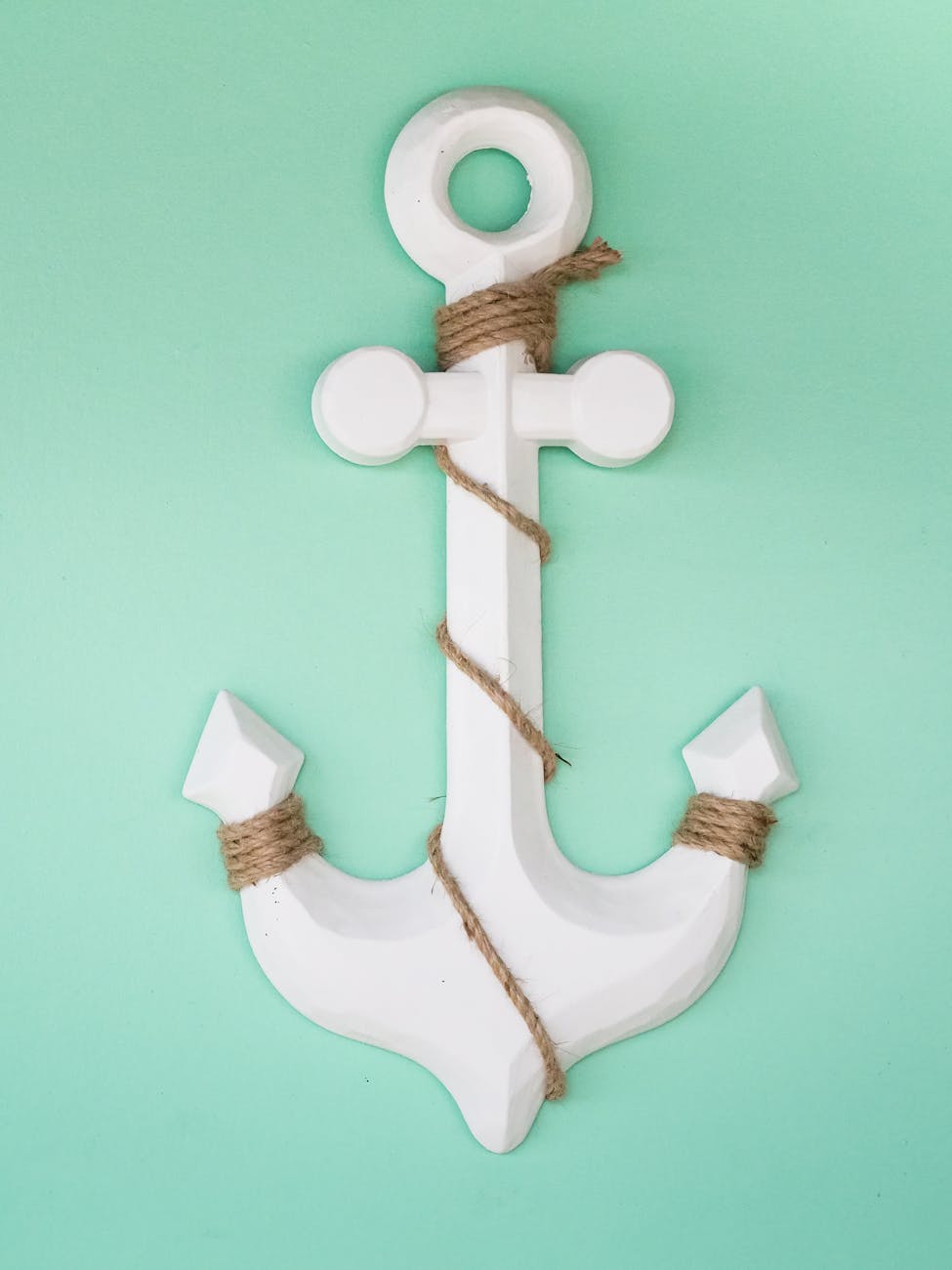 white wooden anchor with rope