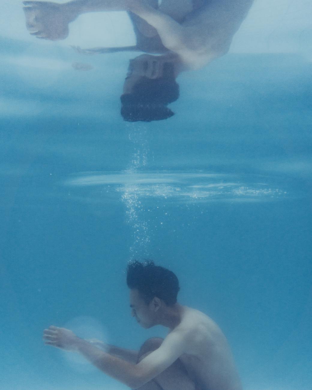 man diving in water